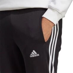 Pantalon Adidas Essentials Jersey Simple Ourlet Ouvert Fuselé 3 Bandes IC0044 -Magasin De Vêtements adidas ic0044 ic0044 5 e